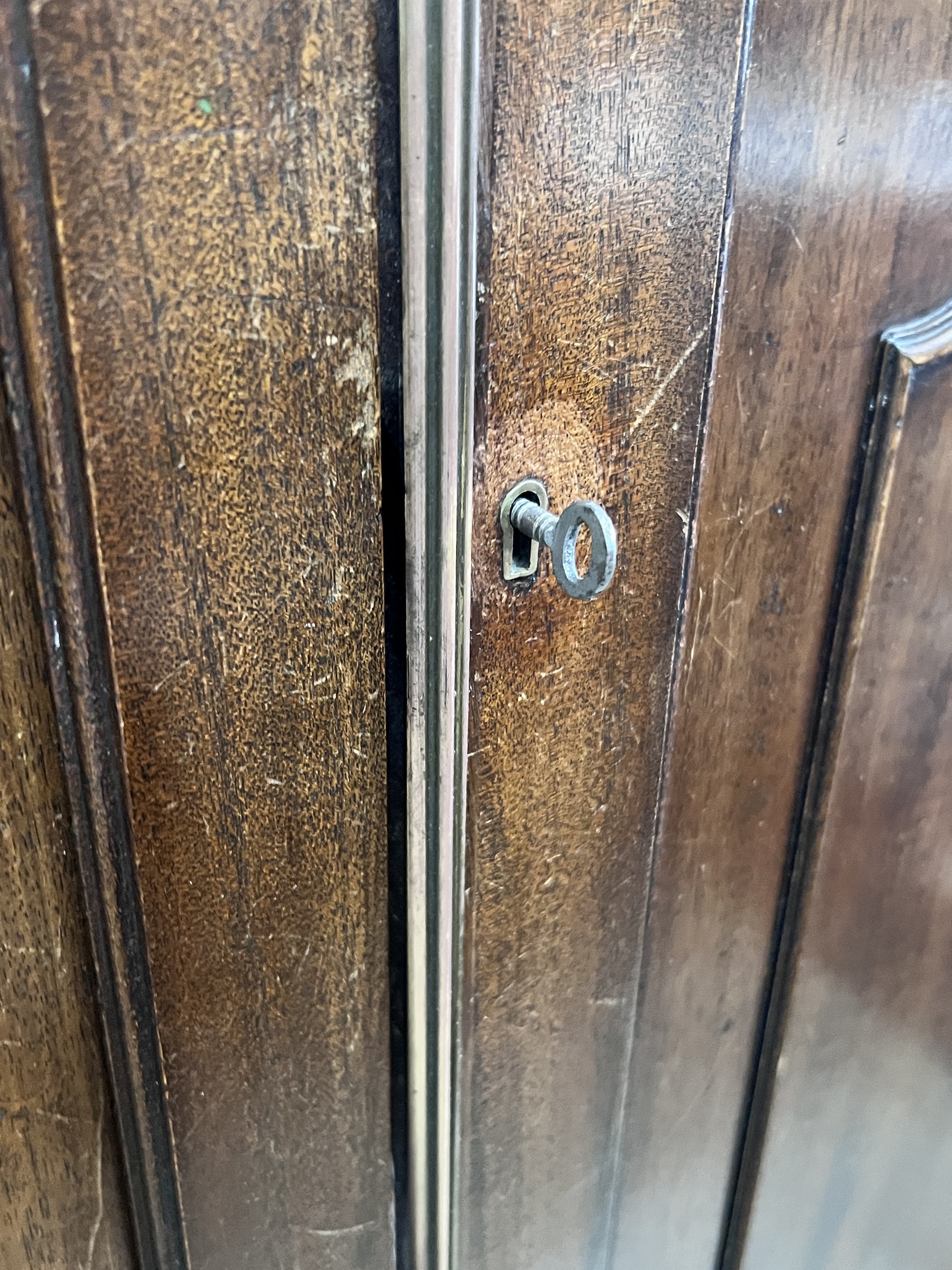 An Edwardian George III style mahogany two door wardrobe, width 132cm, depth 50cm, height 195cm